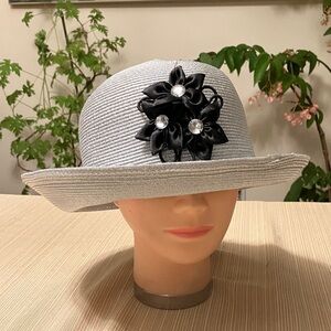 Elegant Metallic Silver Women's Hat with Black Floral Accent